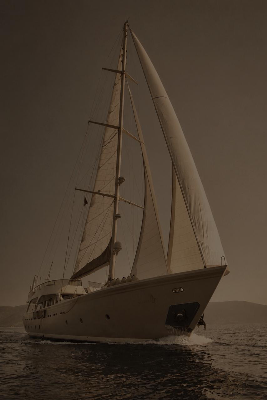 Sailing yacht on calm water at dusk