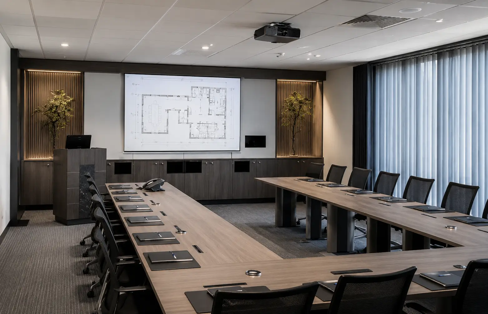 The Executive Business Center — a calm, contemplative room with soft lighting, translucent layers and curated planting