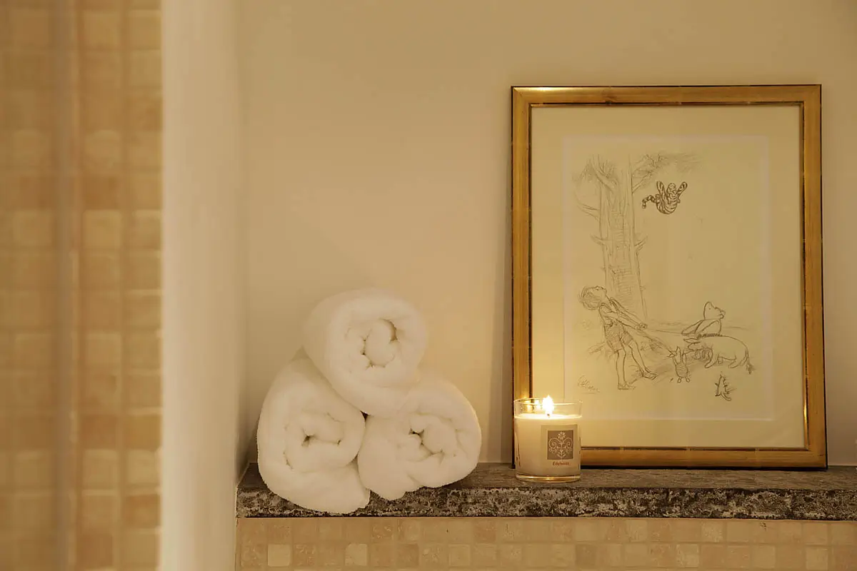 Guest bathroom detail in natural stone and wood