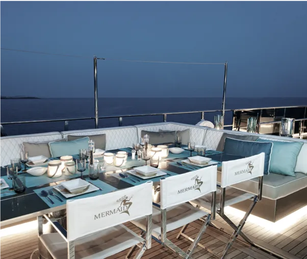 Evening dinner setting on deck aboard M/Y Mermaid