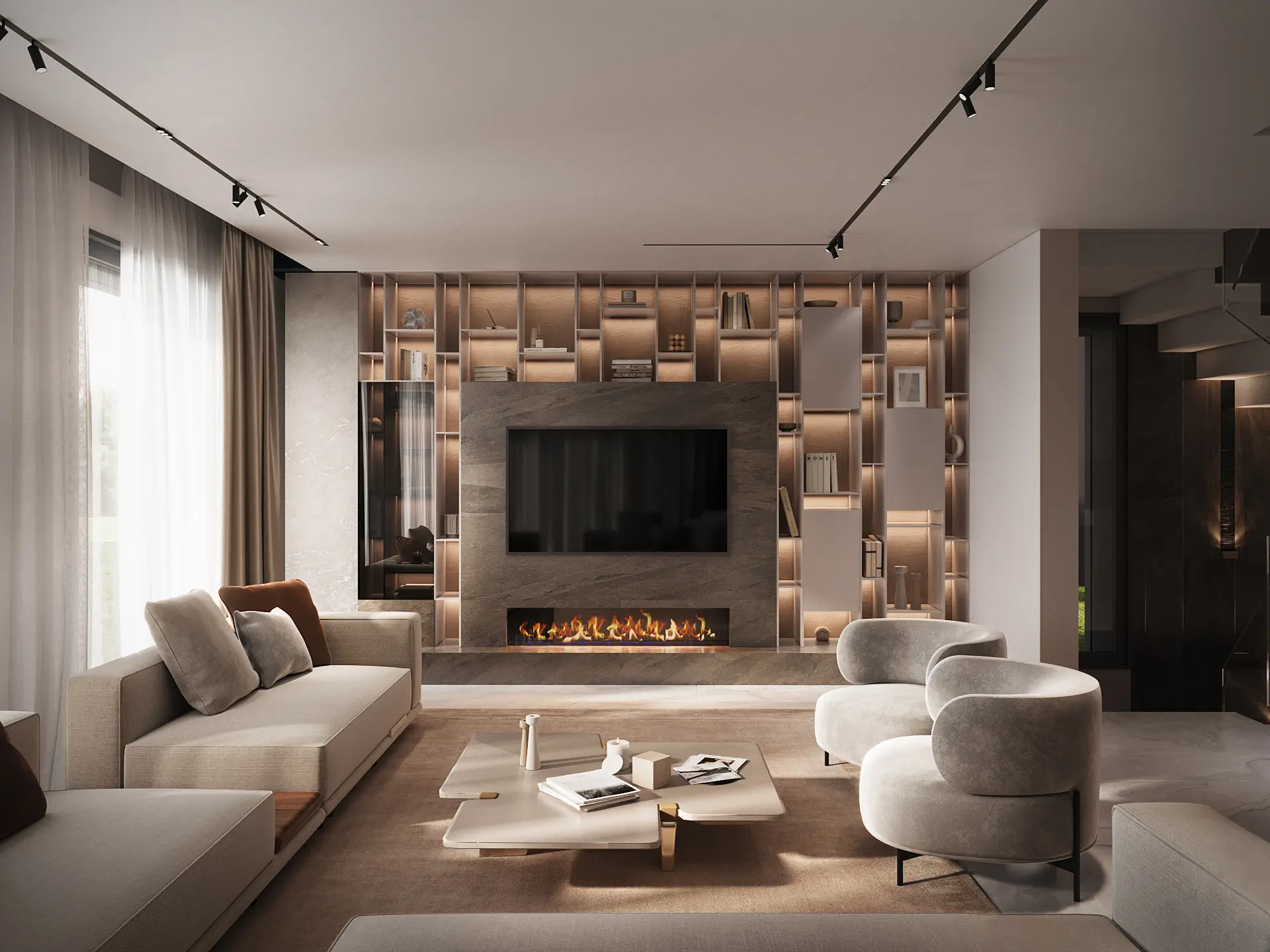 Villa D living room with a grey stone media wall, linear gas fireplace, and warmly backlit floor-to-ceiling shelving